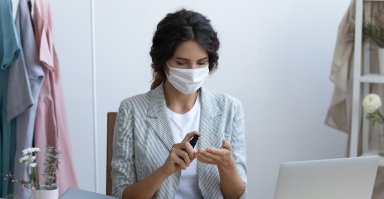 female-professional-with-sanitiser.jpg